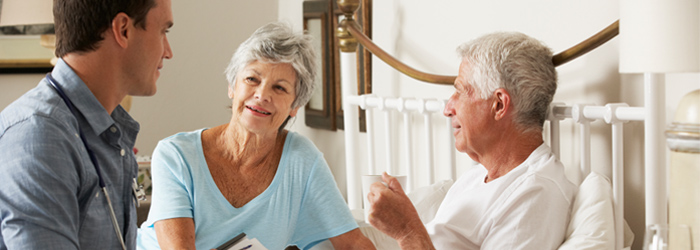 Patient caretaker smiling at healthcare professional